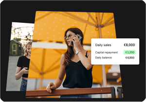Arrangør med telefonen ved siden af en oversigt over dagens salg og udbetalinger
